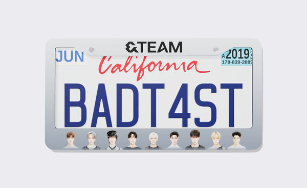 &TEAM license plate frame with black &TEAM logo on a white-to-silver gradient border and nine member portraits along the bottom, shown around a California demo plate