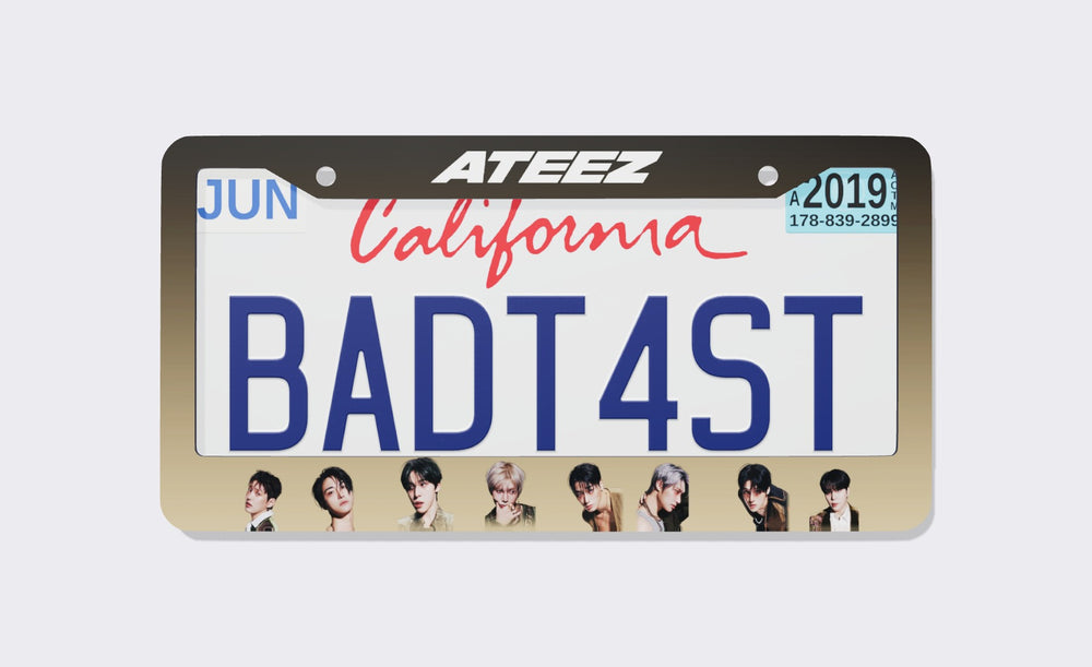 ATEEZ license plate frame front view: dark brown-to-sand gradient frame with the white ATEEZ logo on top and eight member portraits along the bottom, shown on a California plate