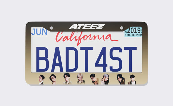 ATEEZ license plate frame front view: dark brown-to-sand gradient frame with the white ATEEZ logo on top and eight member portraits along the bottom, shown on a California plate