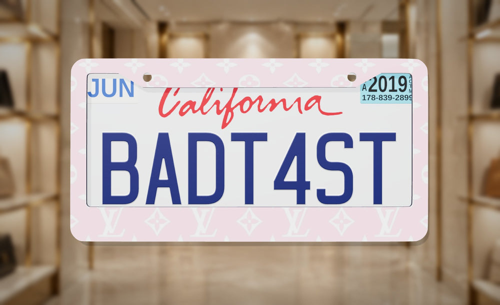 LV Pink license plate frame on a themed background