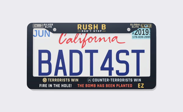 Navy CS:GO memes license plate frame reading Rush B Don't Stop between Silver Elite and Global Elite badges, with Terrorists Win, Counter-Terrorists Win, Fire in the Hole, The Bomb Has Been Planted and EZ on the bottom, front view