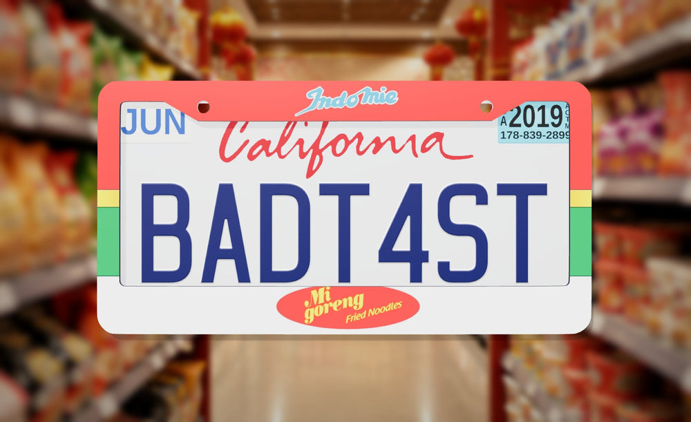 Indomie Mi Goreng Noodles license plate frame on a themed background