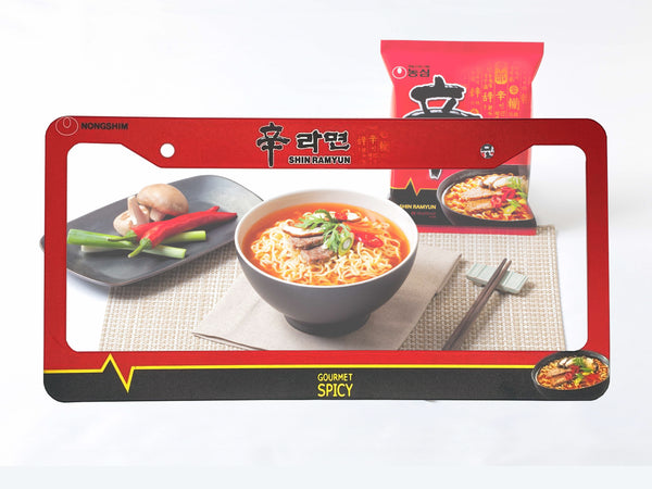 Red Nongshim Shin Ramyun noodle license plate frame with a ramen bowl