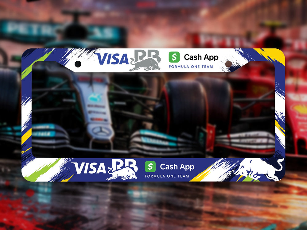 Navy Visa Cash App RB Formula One Team license plate frame in front of F1 cars on a wet track