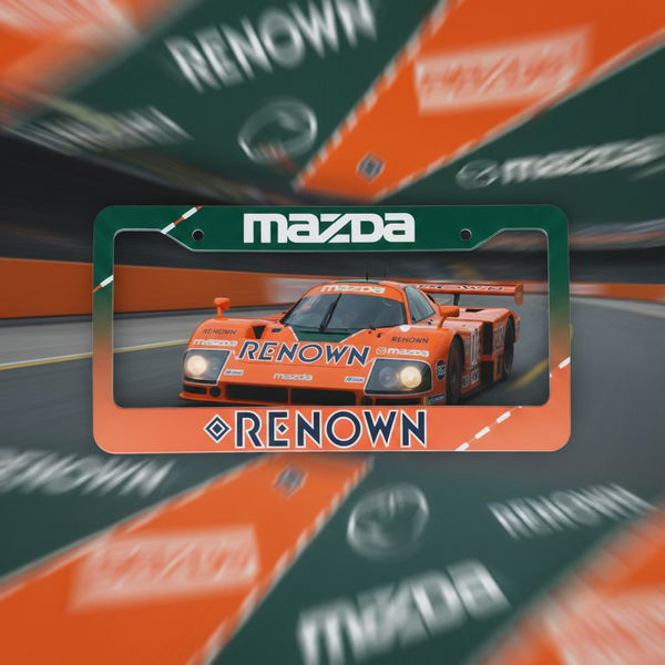 License plate frame with Mazda logo and 'Renown' branding on a gray surface