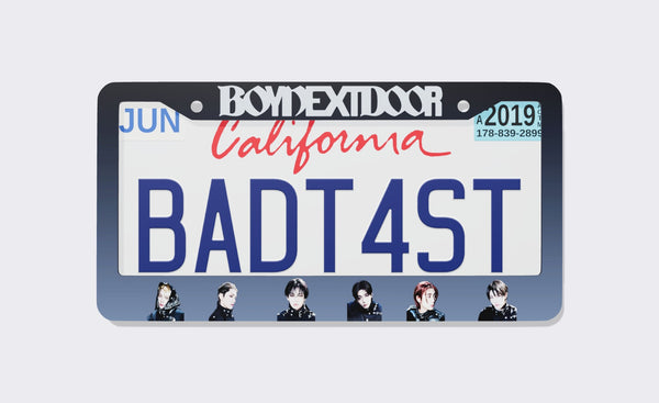 BOYNEXTDOOR license plate frame with large white BOYNEXTDOOR logo on a black-to-slate-blue gradient border and six members in black outfits along the bottom, shown around a California demo plate