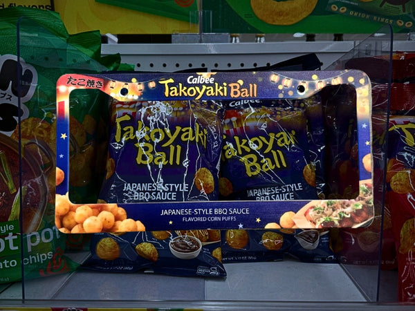 Calbee Takoyaki Ball license plate frame on a store shelf