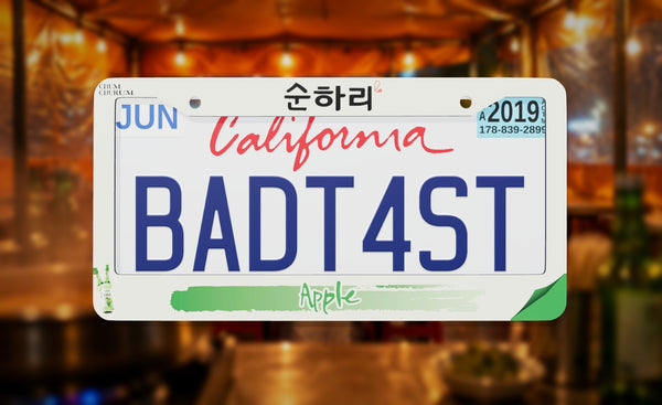 Chum Churum Apple license plate frame on a themed background