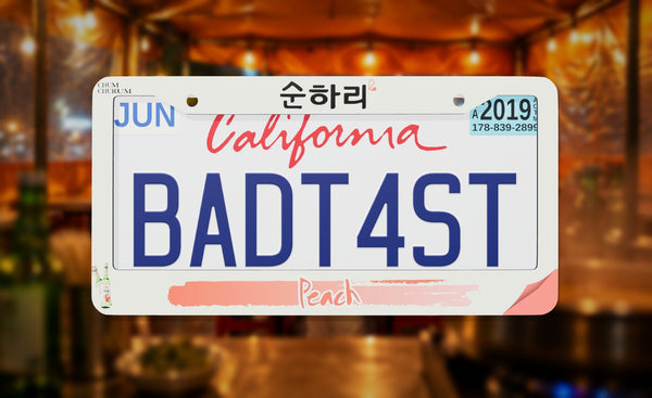 Chum Churum Peach license plate frame on a themed background