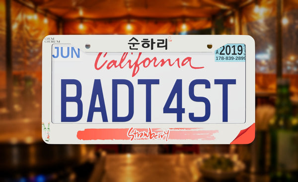Chum Churum Strawberry license plate frame on a themed background
