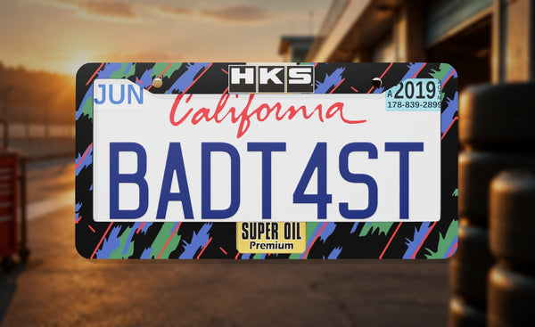 HKS Super oil license plate frame on a themed background