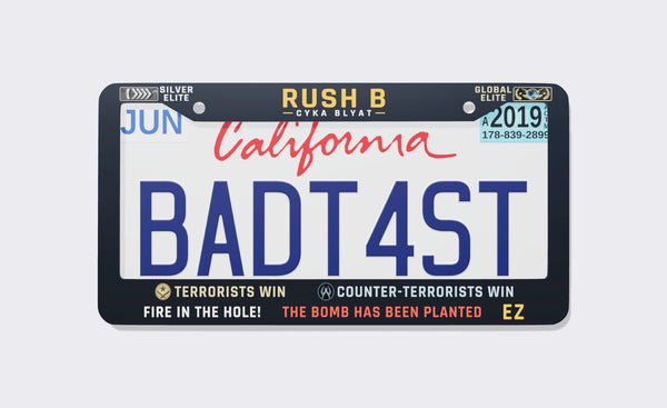 Navy CS:GO memes license plate frame reading Rush B Don't Stop between Silver Elite and Global Elite badges, with Terrorists Win, Counter-Terrorists Win, Fire in the Hole, The Bomb Has Been Planted and EZ on the bottom, front view