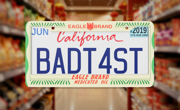 Eagle Brand Medicated Oil license plate frame on a themed background