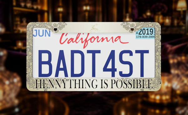 Hennything is Possible license plate frame on a themed background