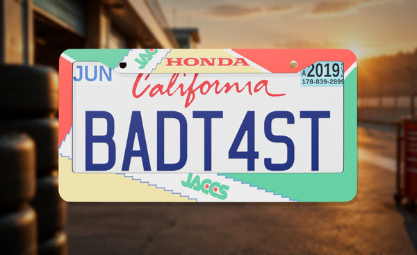 JACCS Honda license plate frame on a themed background