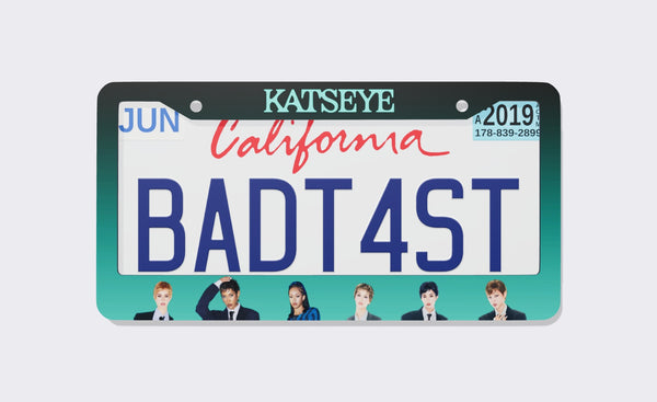 KATSEYE license plate frame, 2026 edition, front view: dark-to-teal gradient frame with the KATSEYE wordmark on top and member portraits along the bottom, shown on a California plate