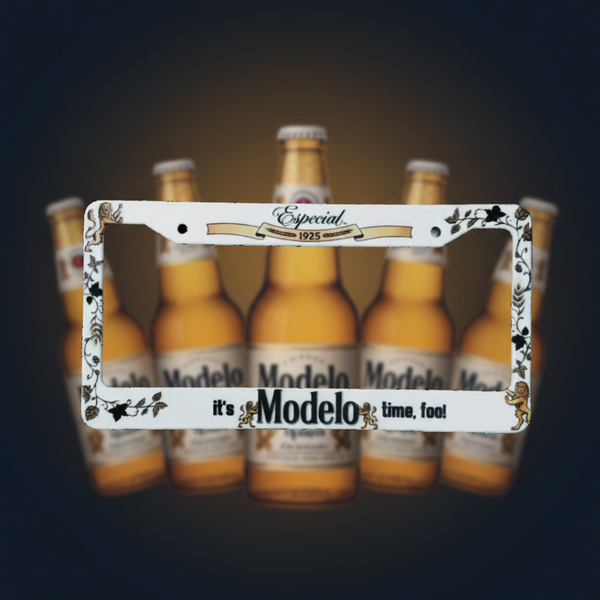 White Modelo Especial beer license plate frame with It's Modelo time fool text and bottles