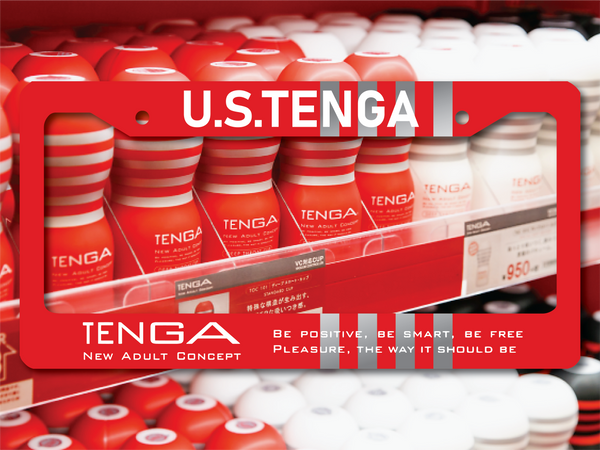 Red Tenga license plate frame with product shelf background