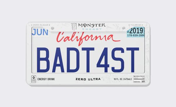 White Monster Energy license plate frame, front view: white frame with Monster Energy claw logo on top, Zero Sugar and Taurine callouts, and Energy Drink, Zero Ultra, 16 fl oz and Nutrition Facts details along the bottom