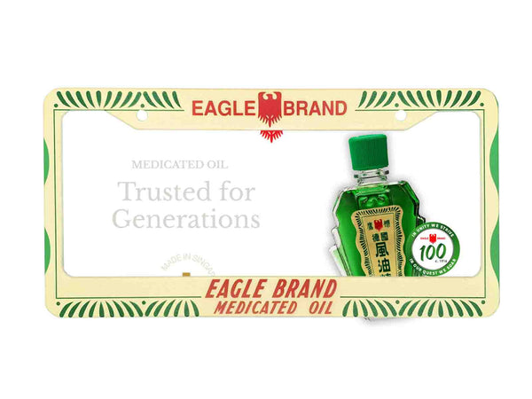 Cream and green Eagle Brand Medicated Oil license plate frame with a bottle graphic