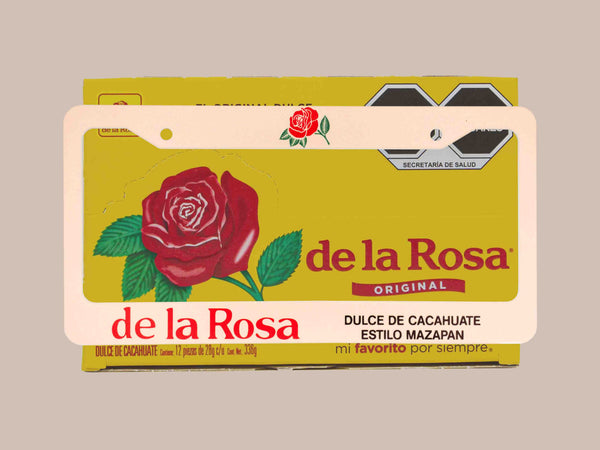 Cream and yellow de la Rosa mazapan candy license plate frame with rose artwork