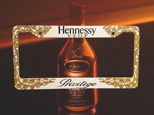 White and gold Hennessy VSOP Privilege cognac license plate frame with a bottle