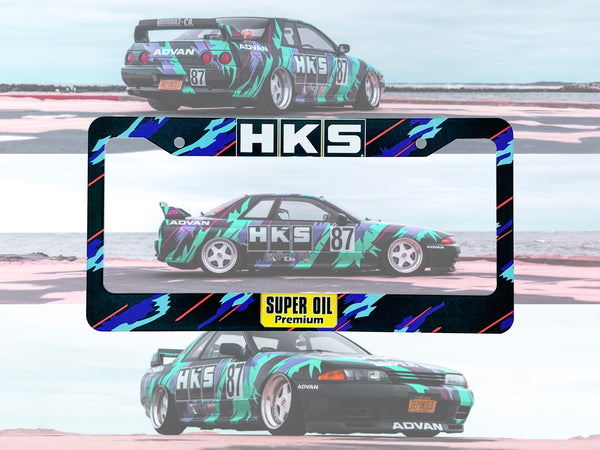 Black HKS Super Oil license plate frame with a green and black Nissan Skyline race car