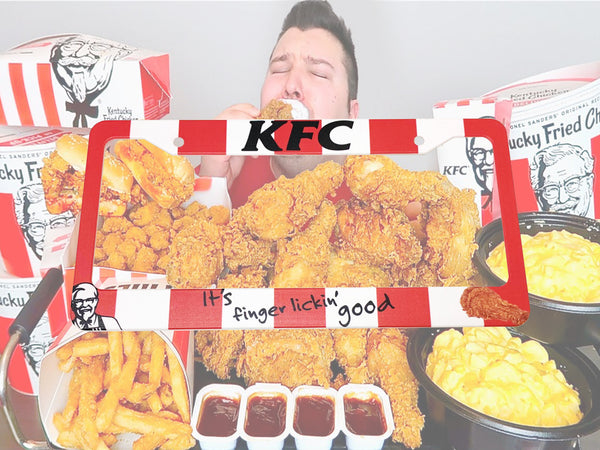 Red and white KFC license plate frame with It's finger lickin good slogan and fried chicken