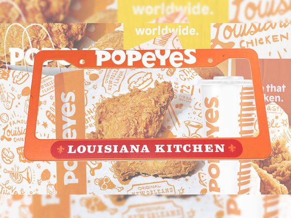 Orange Popeyes Louisiana Kitchen license plate frame with fried chicken