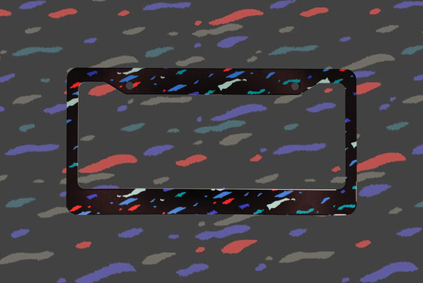 Black Recaro confetti pattern license plate frame with red blue and grey speckles