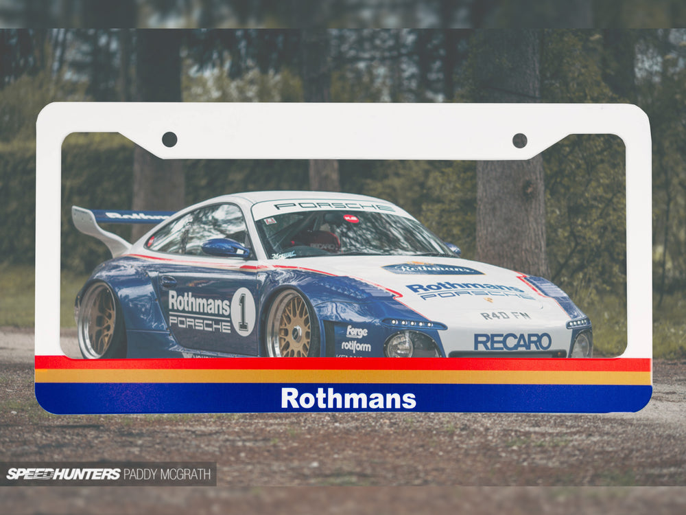 White Rothmans Porsche racing license plate frame with a blue and white race car